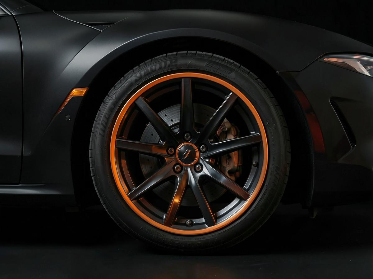 Low-profile performance tire on a sports sedan